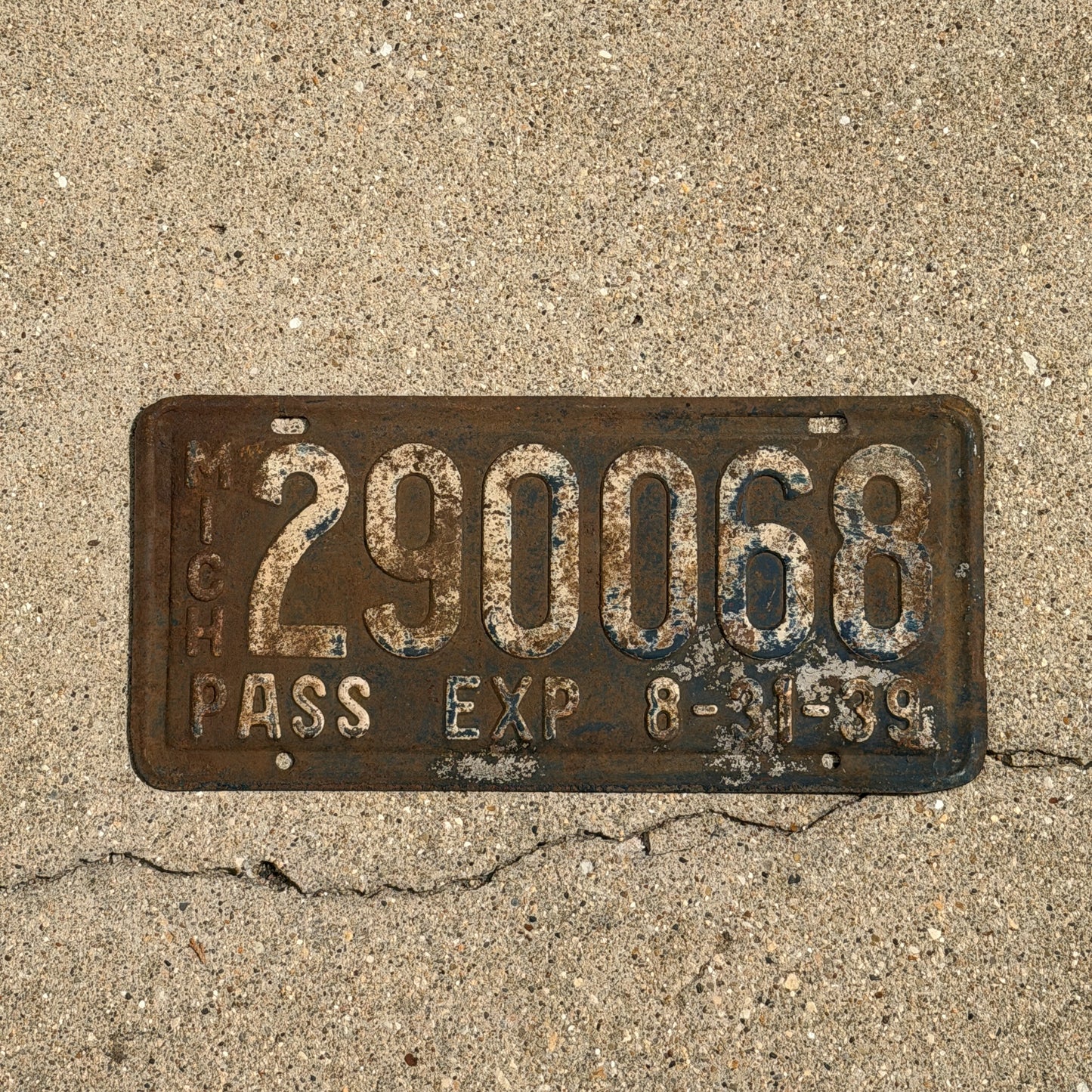 Photo of a 1939 Michigan License Plate Auto Tag Garage Decor Vintage Half Year 290 068 with original patina