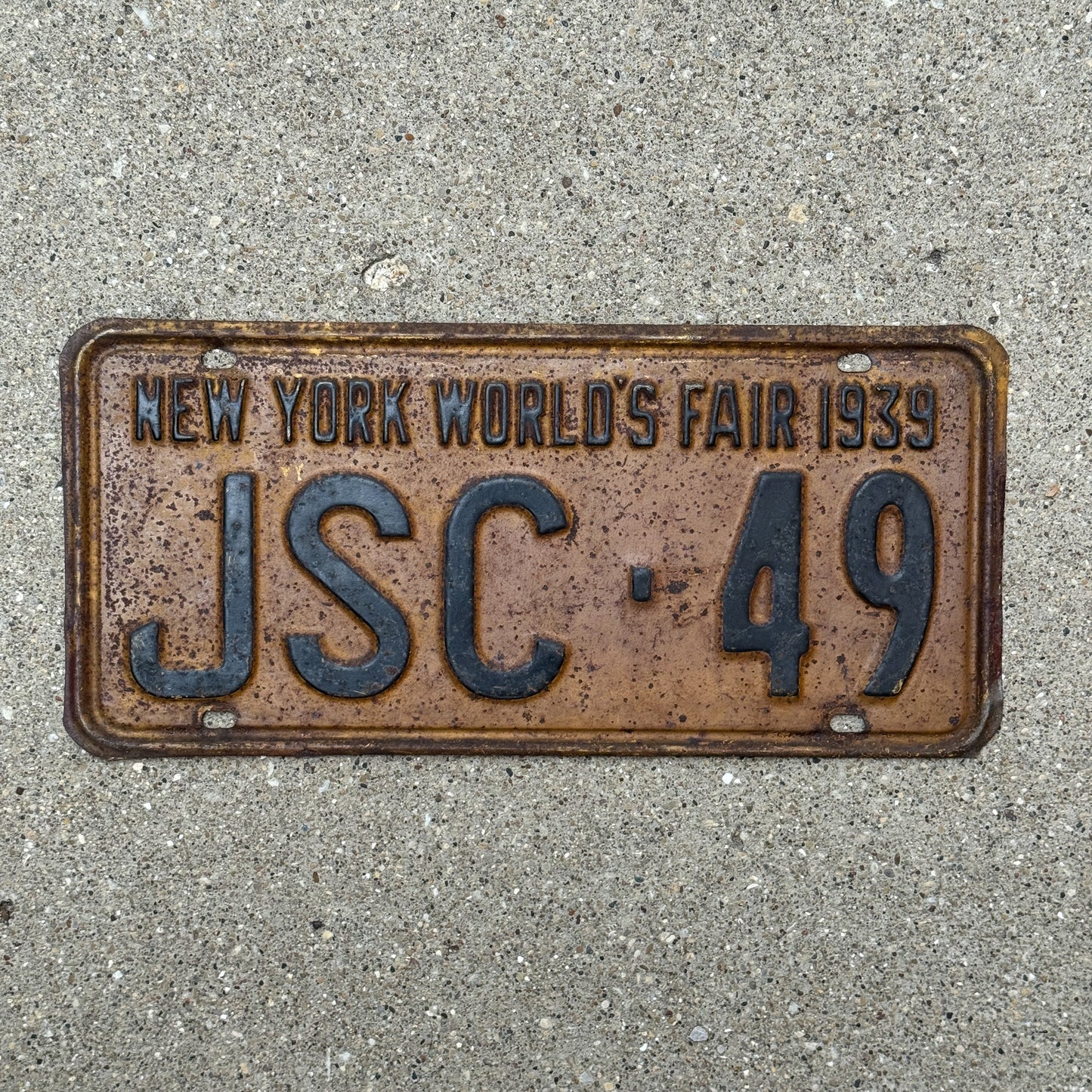 Photo of a 1939 New York Supreme Court Justice License Plate Auto Tag Garage Decor Vintage Judge World's Fair JSC 49 with original patina
