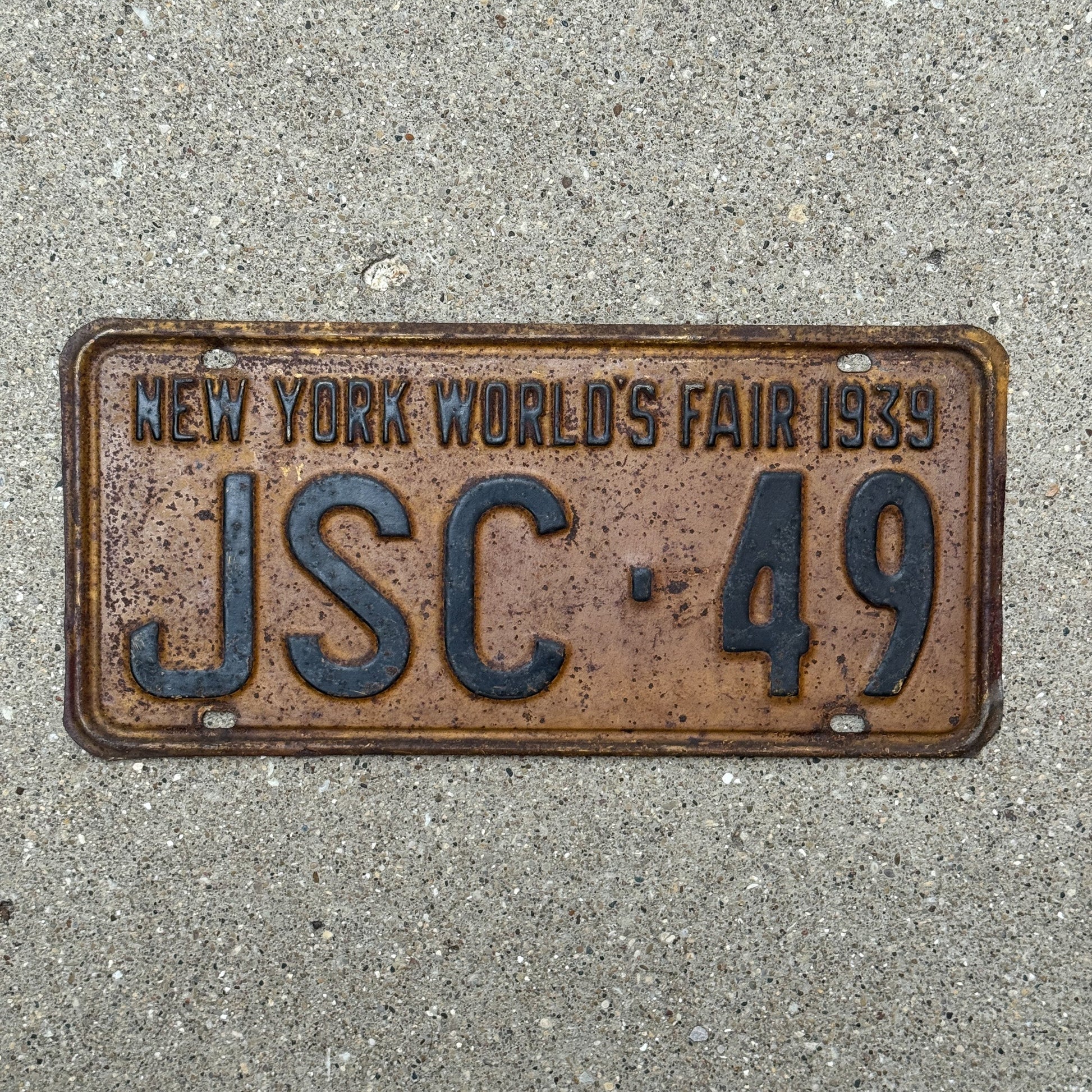 Photo of a 1939 New York Supreme Court Justice License Plate Auto Tag Garage Decor Vintage Judge World's Fair JSC 49 with original patina