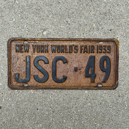 Photo of a 1939 New York Supreme Court Justice License Plate Auto Tag Garage Decor Vintage Judge World's Fair JSC 49 with original patina