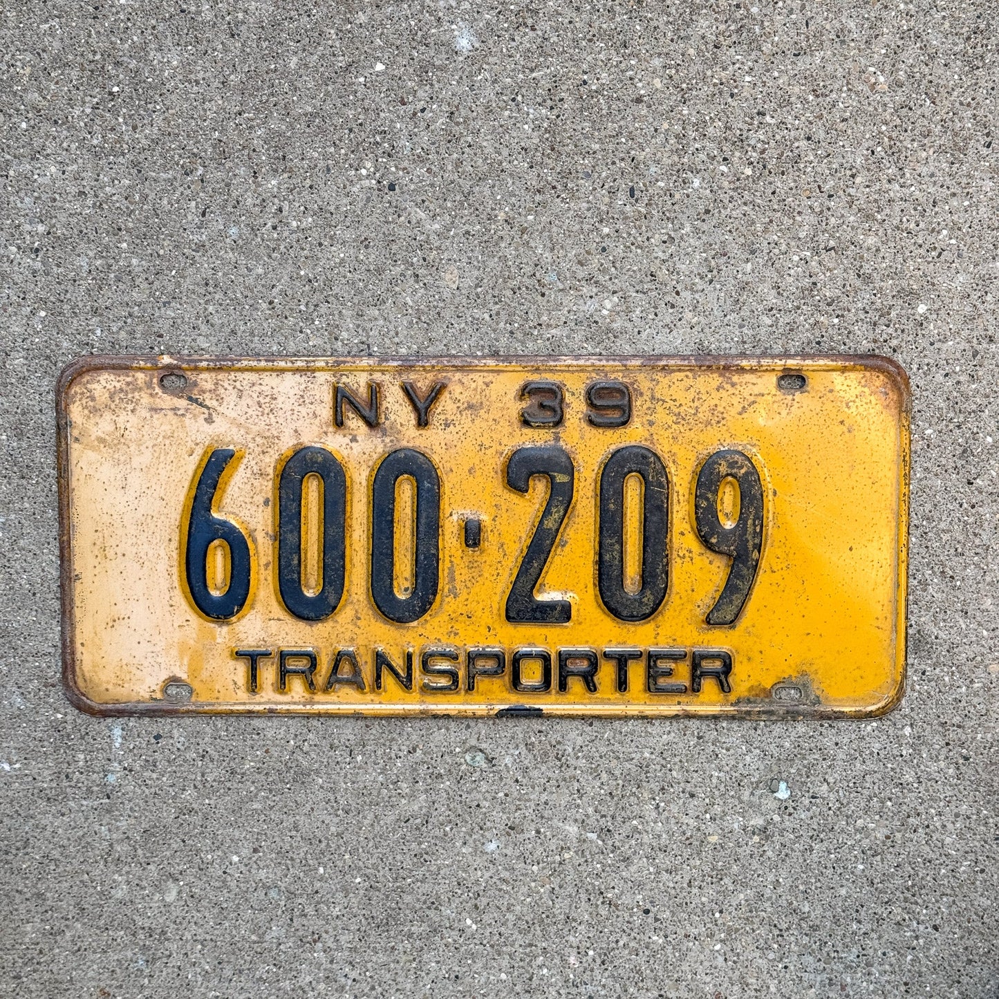 Photo of a 1939 New York Transporter License Plate Auto Tag Garage Decor Vintage ALPCA Archive Example Hard to Find Type 600 209 with original patina