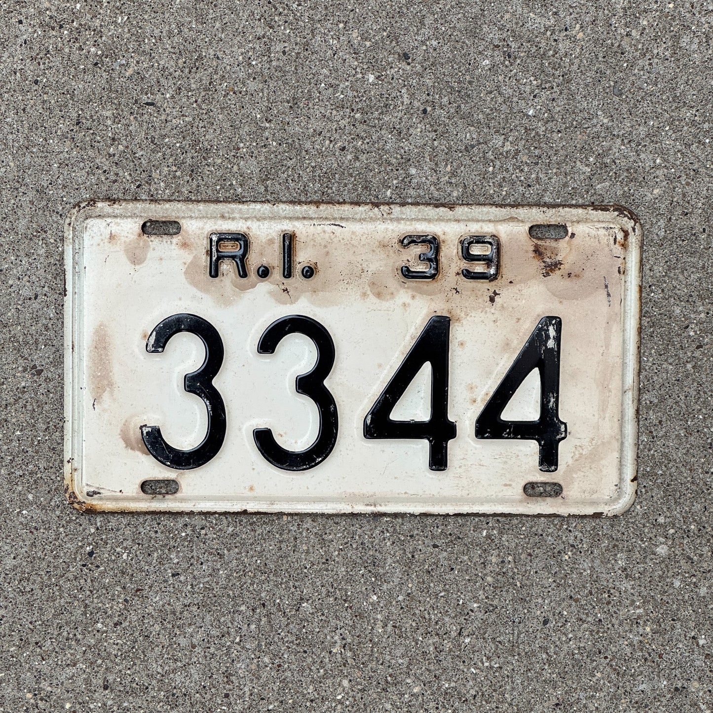 Photo of a 1939 Rhode Island License Plate Auto Tag Garage Decor Vintage Low Number Four Digit 3344 with original patina