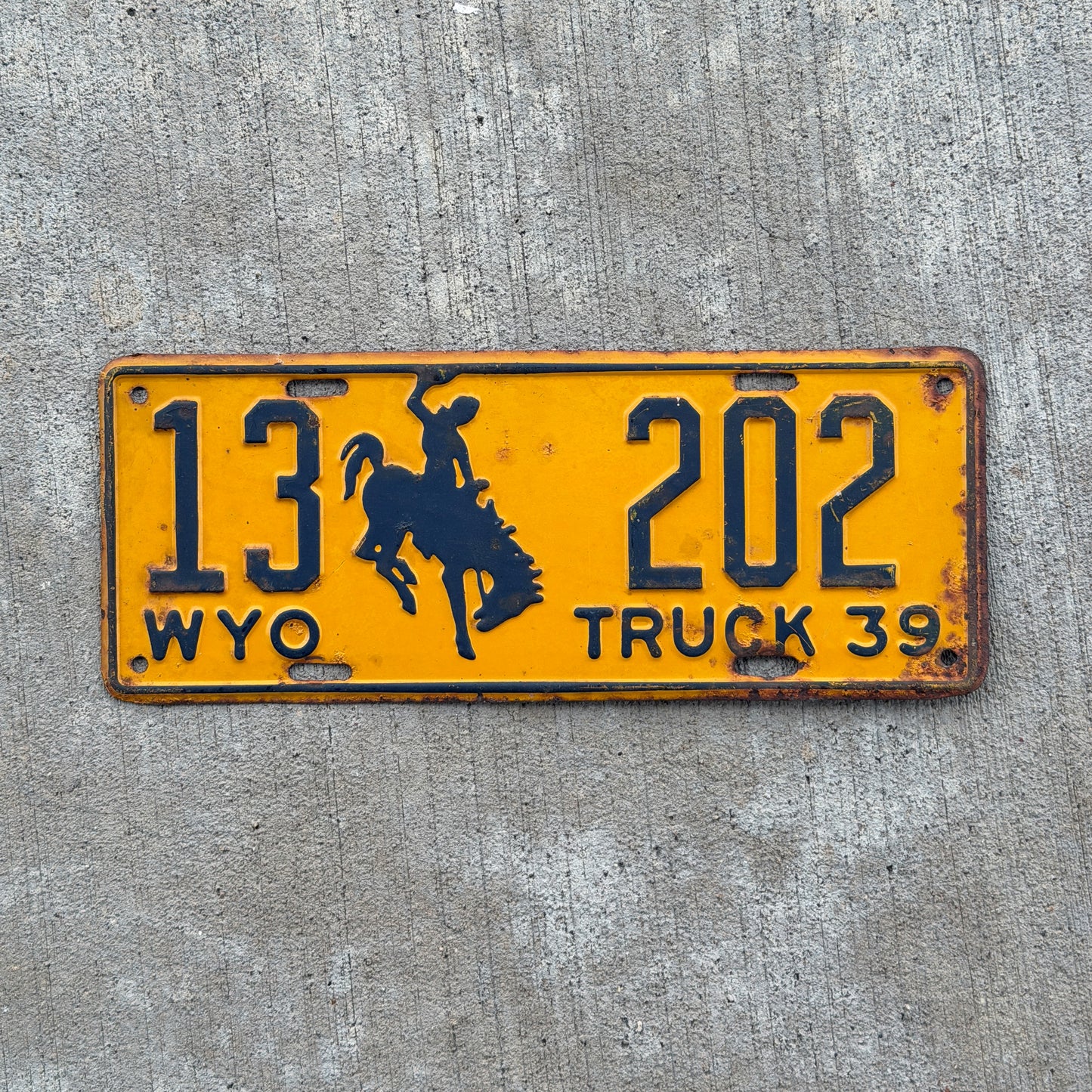 Photo of a 1939 Wyoming Truck License Plate Auto Tag Garage Decor Vintage Cowboy Rodeo 13 202 with original patina