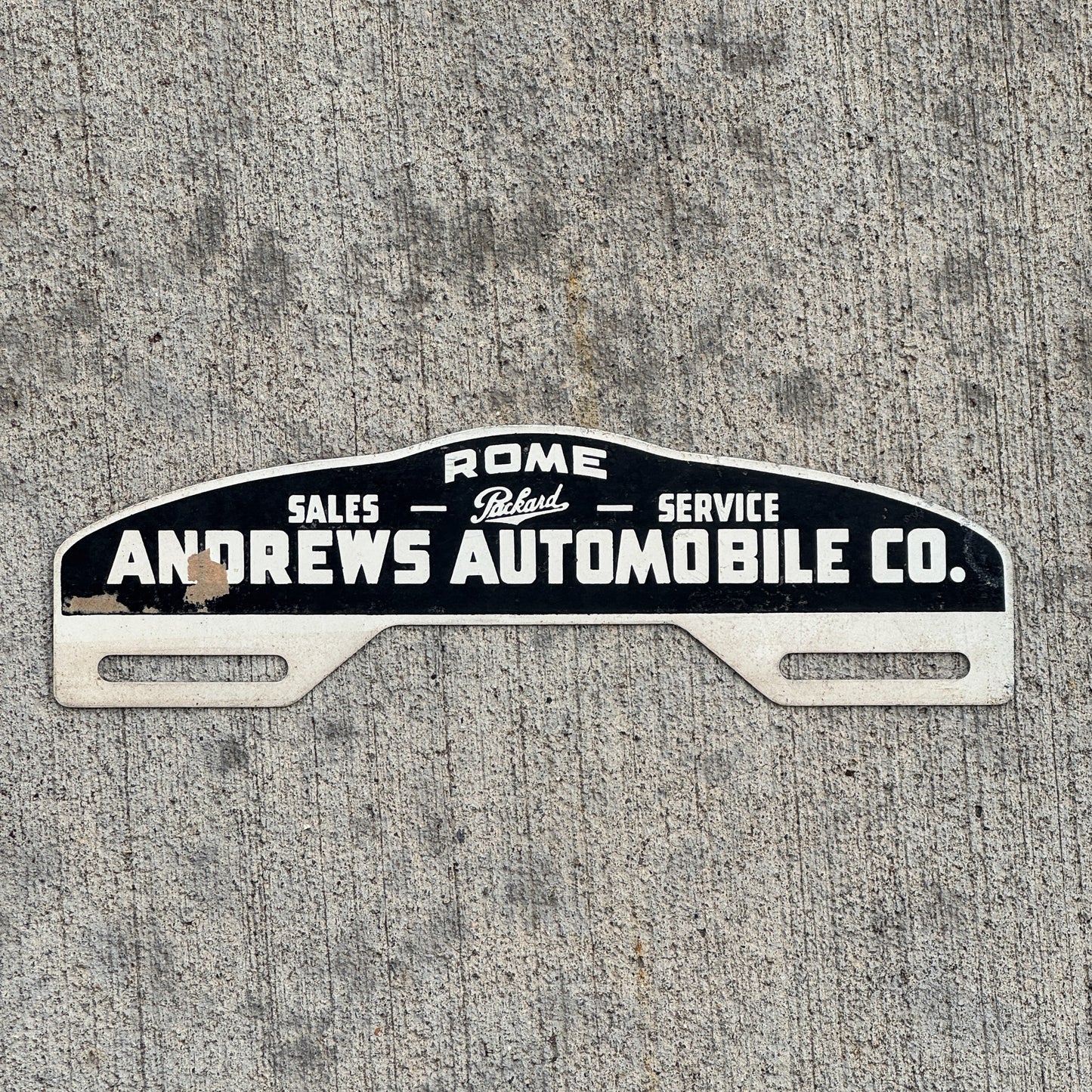 Photo of a 1940 Era Andrews Auto Co Rome Georgia License Plate Topper Auto Tag Garage Decor Vintage Parkard Dealer with original patina