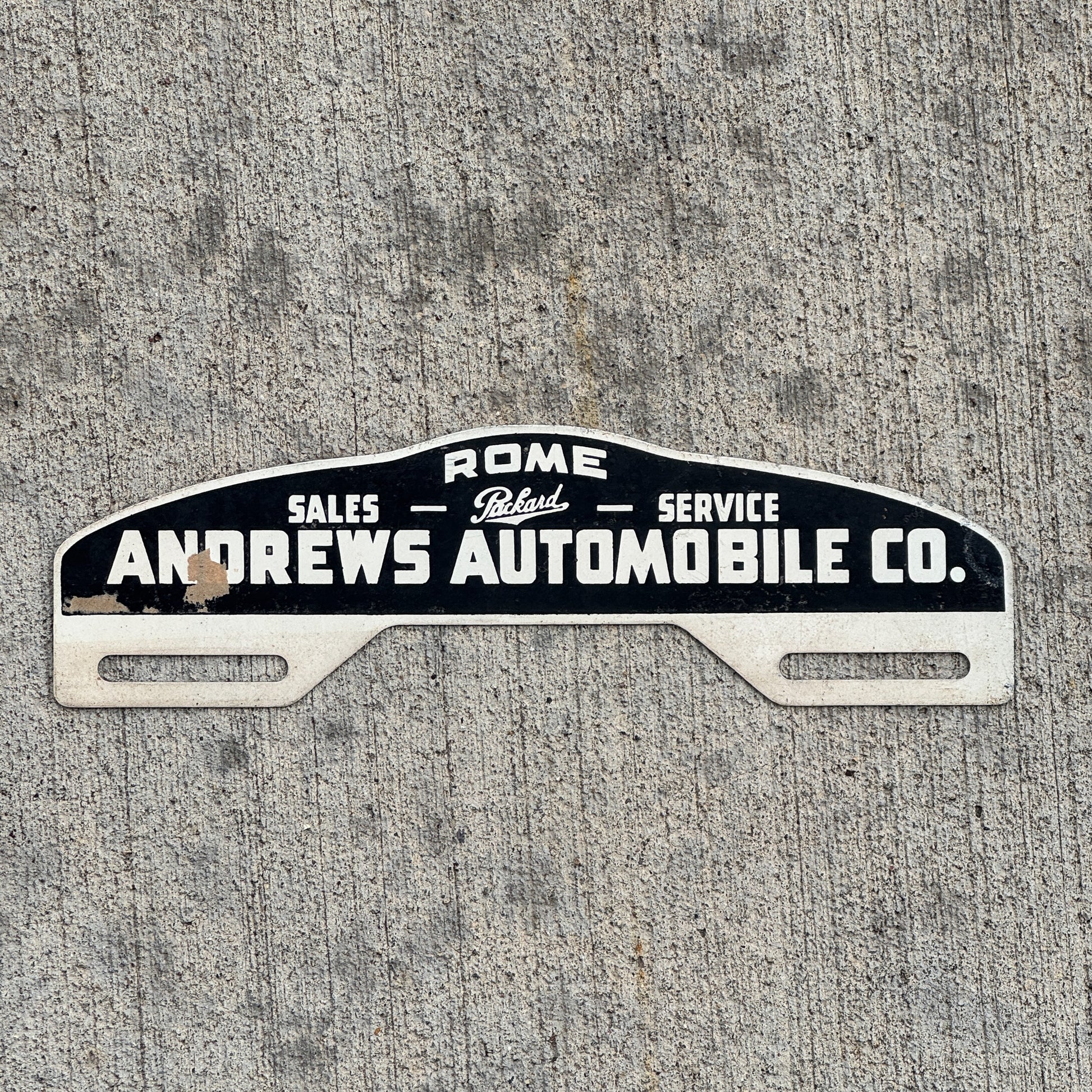 Photo of a 1940 Era Andrews Auto Co Rome Georgia License Plate Topper Auto Tag Garage Decor Vintage Parkard Dealer with original patina