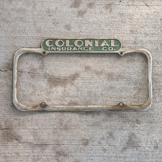 Photo of a 1940 Era California License Plate Frame Auto Tag Garage Decor Vintage Colonial Insurance Co with original patina