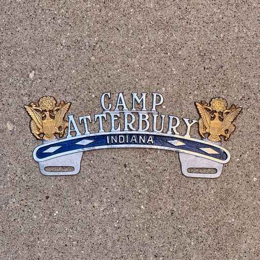 Photo of a 1940 Era Camp Atterbury Indiana License Plate Topper Auto Tag Garage Decor Vintage Military National Guard Cast Aluminum with original patina