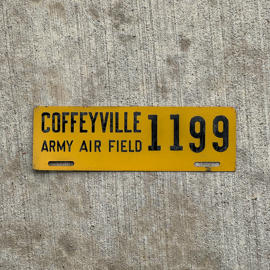 Photo of a 1940 Era Coffeyville Army Air Field Kansas License Plate Topper Auto Tag Garage Decor Vintage Military 1199 with original patina