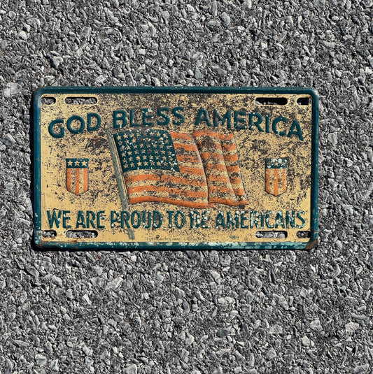 Photo of a 1940 Era God Bless America Booster License Plate Auto Proud to Be Americans Patriotic Flag USA WW2 God Bless America with original patina
