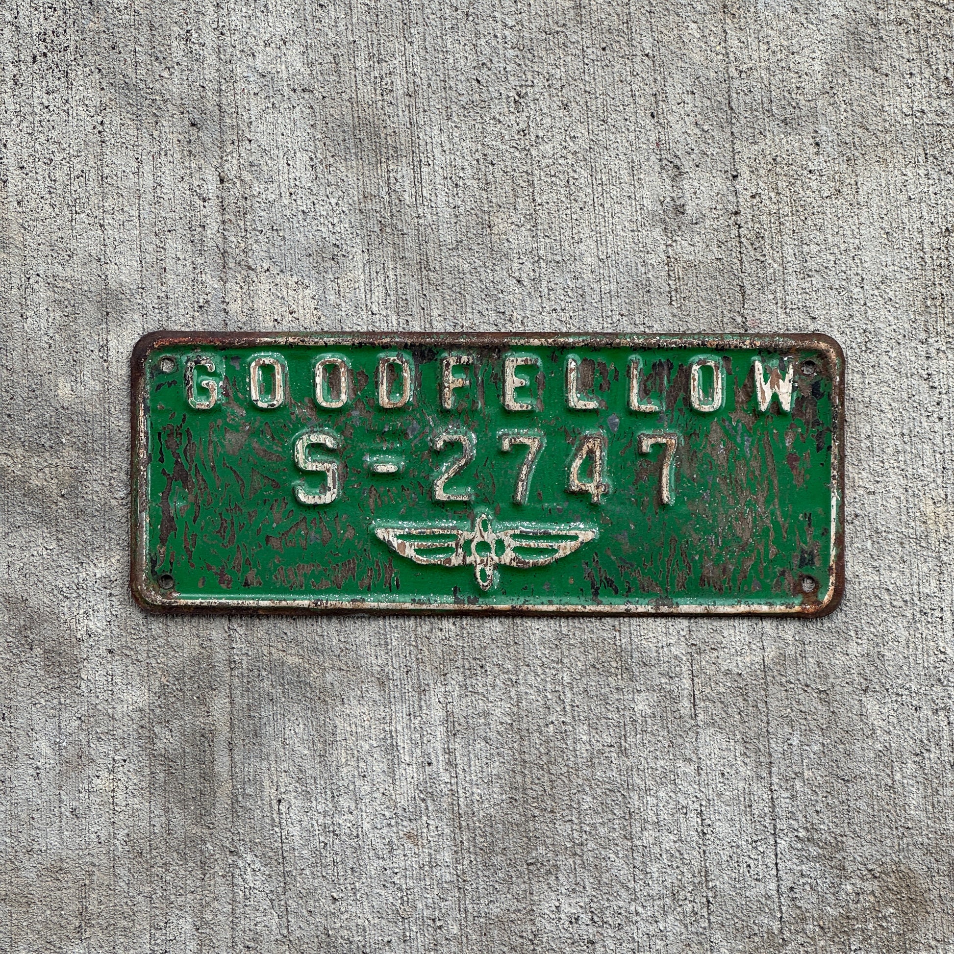 Photo of a 1940 Era Goodfellow Airforce Base Texas License Plate Topper Auto Tag Garage Decor Vintage Goodfellow S-2747 with original patina