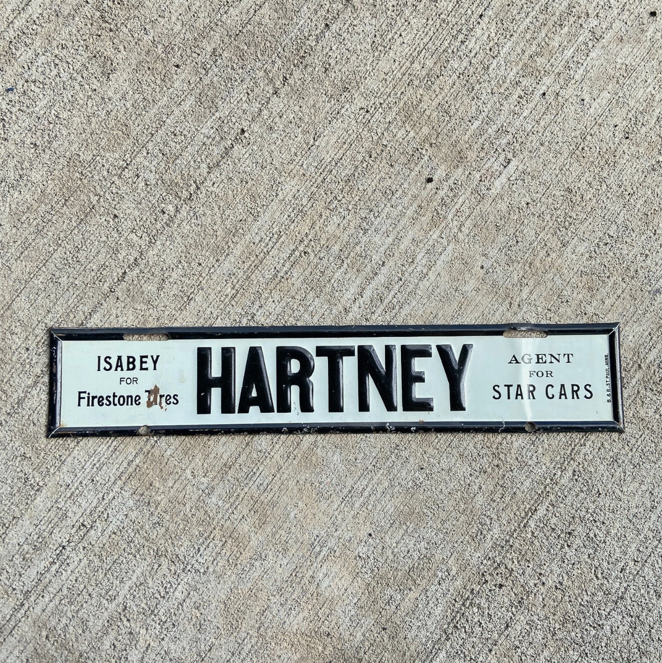 Photo of a 1940 Era Hartney Manitoba License Plate Topper Auto Tag Garage Decor Vintage Firestone Tires Star Cars St. Paul with original patina