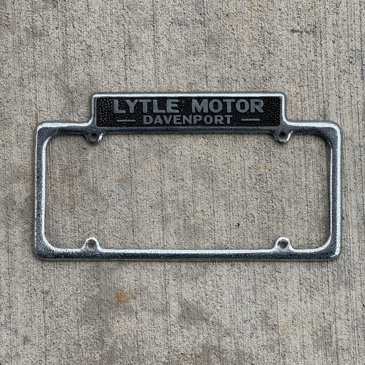 Photo of a 1940 Era Lytle Motor Davenport Iowa License Plate Frame Auto Tag Garage Decor Vintage DeSoto Plymouth Dealer Dealership with original patina