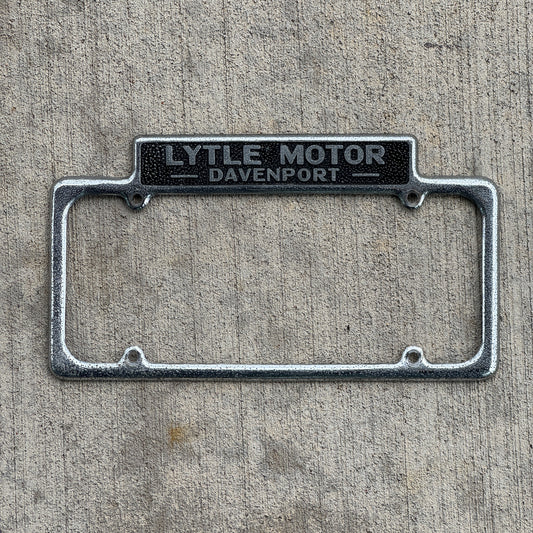 Photo of a 1940 Era Lytle Motor Davenport Iowa License Plate Frame Auto Tag Garage Decor Vintage DeSoto Plymouth Dealer Dealership with original patina