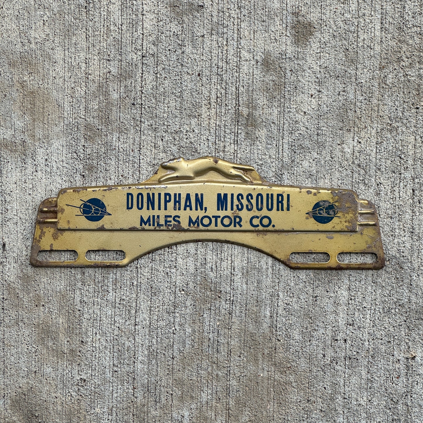 Photo of a 1940 Era Miles Motor Co Doniphan Missouri License Plate Topper Auto Tag Garage Decor Vintage Ford V8 with original patina