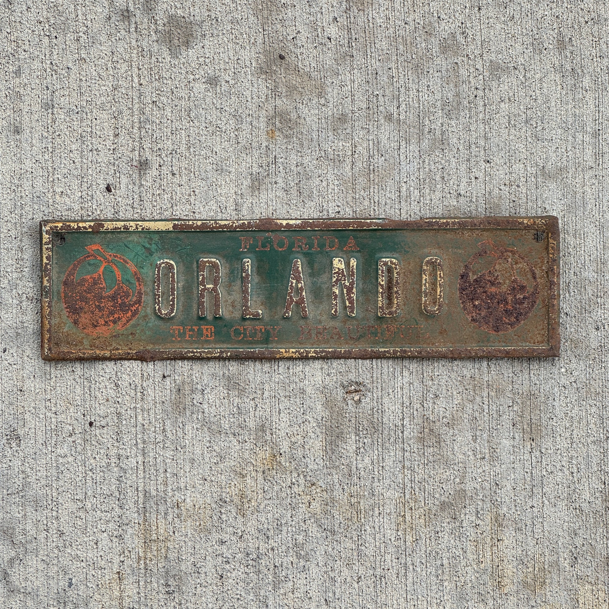Photo of a 1940 Era Orlando Florida License Plate Topper Auto Tag Garage Decor Vintage The City Beautiful with Oranges with original patina