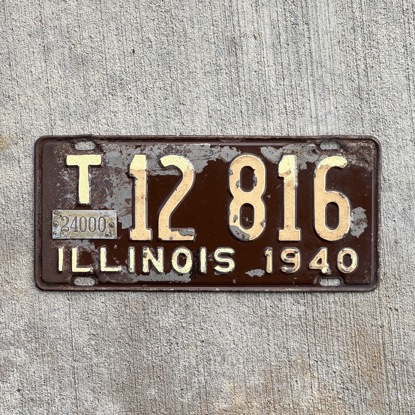 Photo of a 1940 Illinois Truck Mileage Tax License Plate Auto Tag Garage Decor Vintage 24000 LBS T 12 816 with original patina