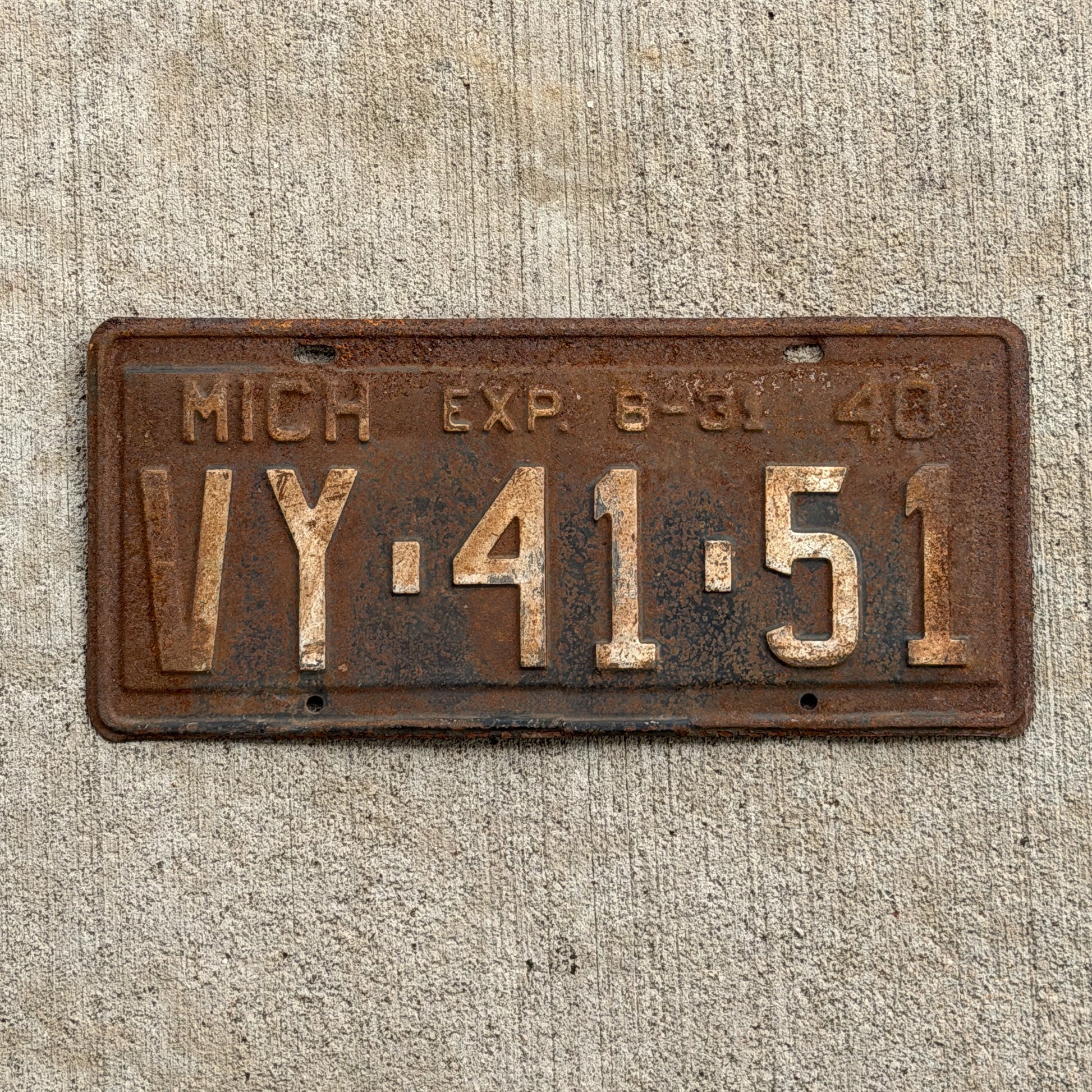 Photo of a 1940 Michigan License Plate Auto Tag Garage Decor Vintage Half Year VY 41 51 with original patina