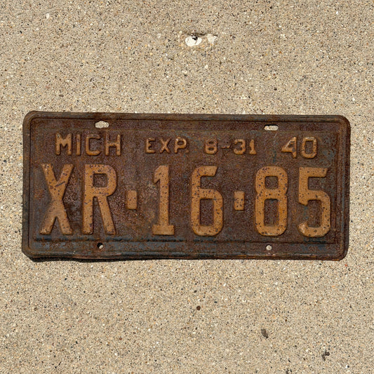 Photo of a 1940 Michigan License Plate Auto Tag Garage Decor Vintage Half Year XR 16 85 with original patina