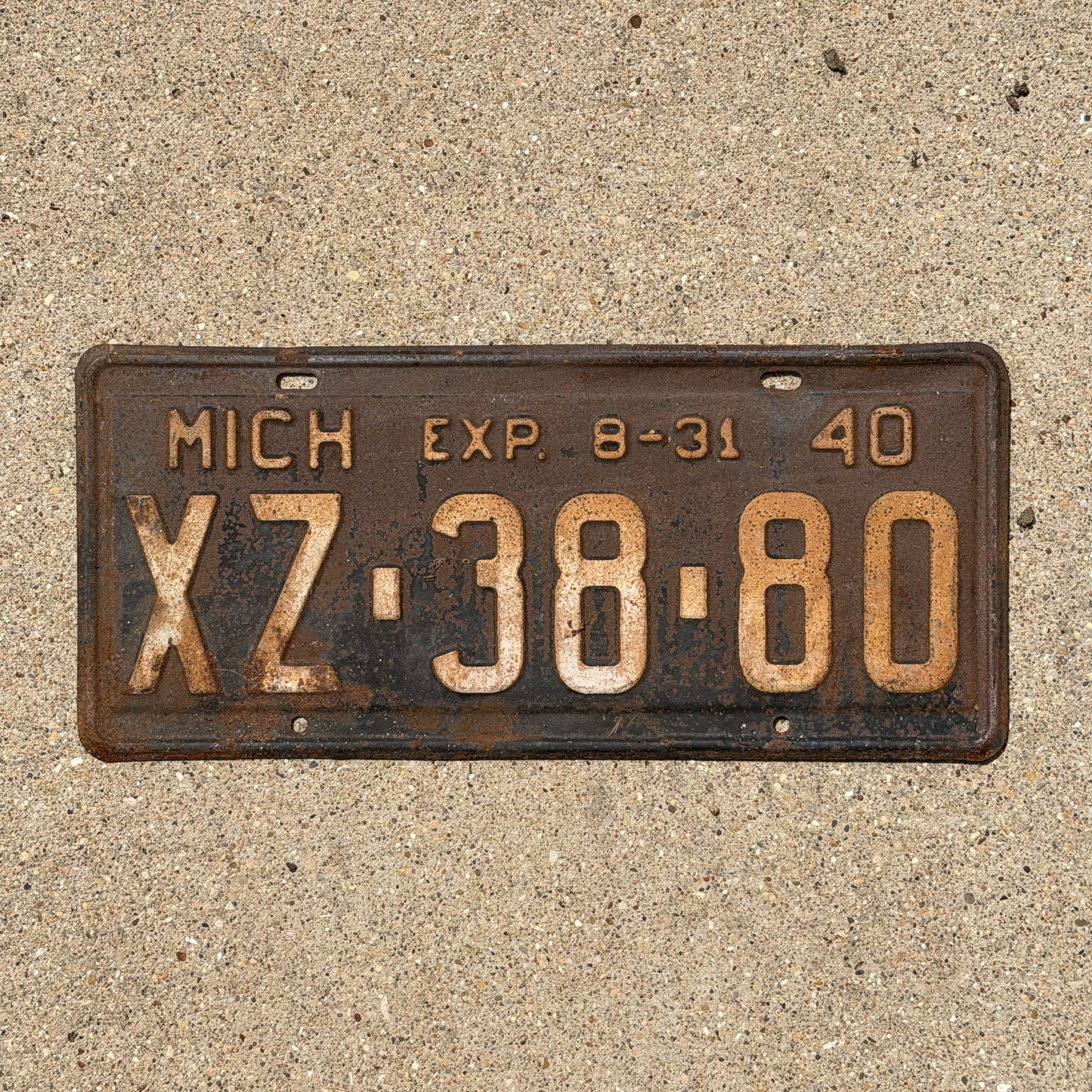 Photo of a 1940 Michigan License Plate Auto Tag Garage Decor Vintage Half Year XZ 38 80 with original patina