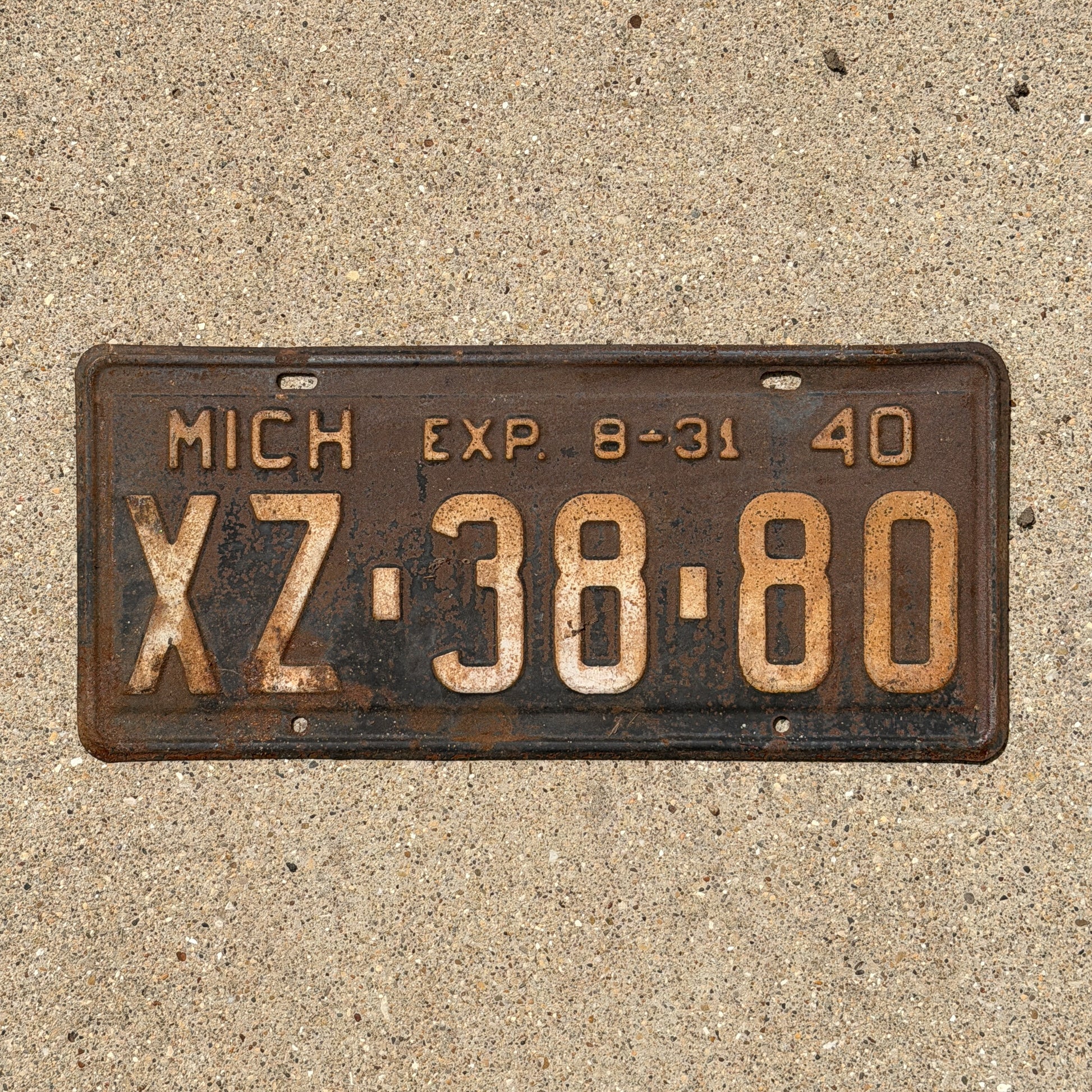 Photo of a 1940 Michigan License Plate Auto Tag Garage Decor Vintage Half Year XZ 38 80 with original patina