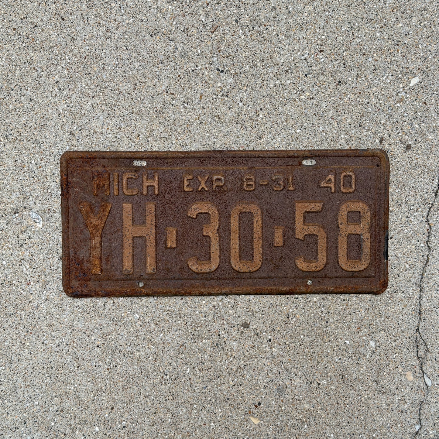 Photo of a 1940 Michigan License Plate Auto Tag Garage Decor Vintage Half Year YH 30 58 with original patina