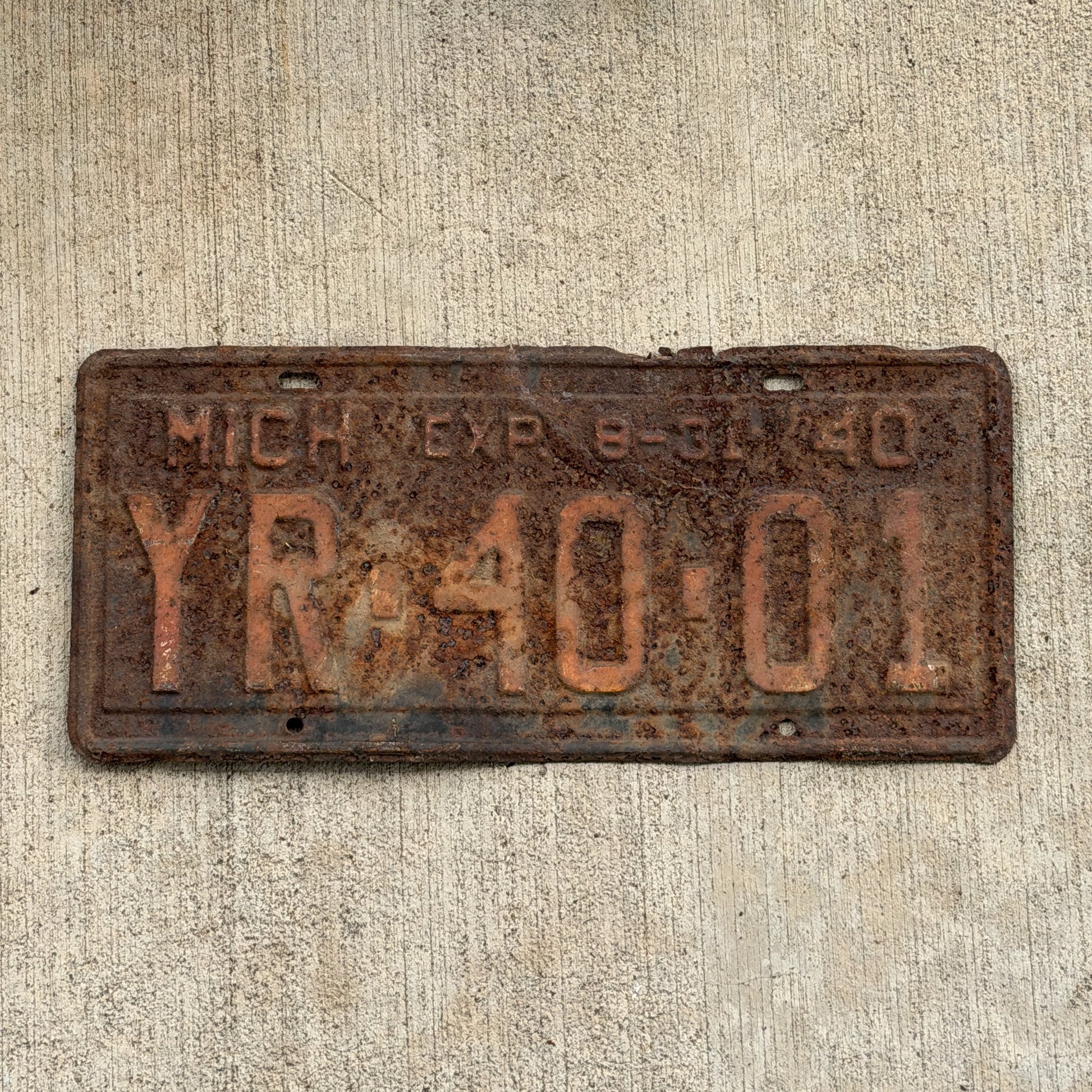 Photo of a 1940 Michigan License Plate Auto Tag Garage Decor Vintage Half Year YR 40 01 with original patina