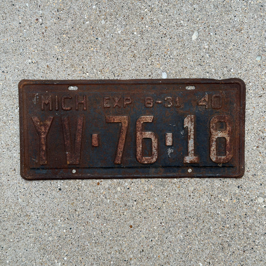 Photo of a 1940 Michigan License Plate Auto Tag Garage Decor Vintage Half Year YV 76 18 with original patina