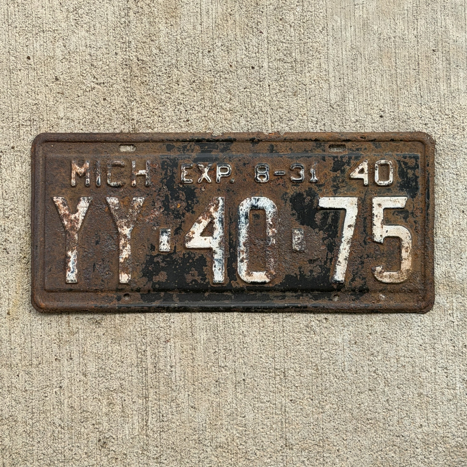 Photo of a 1940 Michigan License Plate Auto Tag Garage Decor Vintage Half Year YY 40 75 with original patina