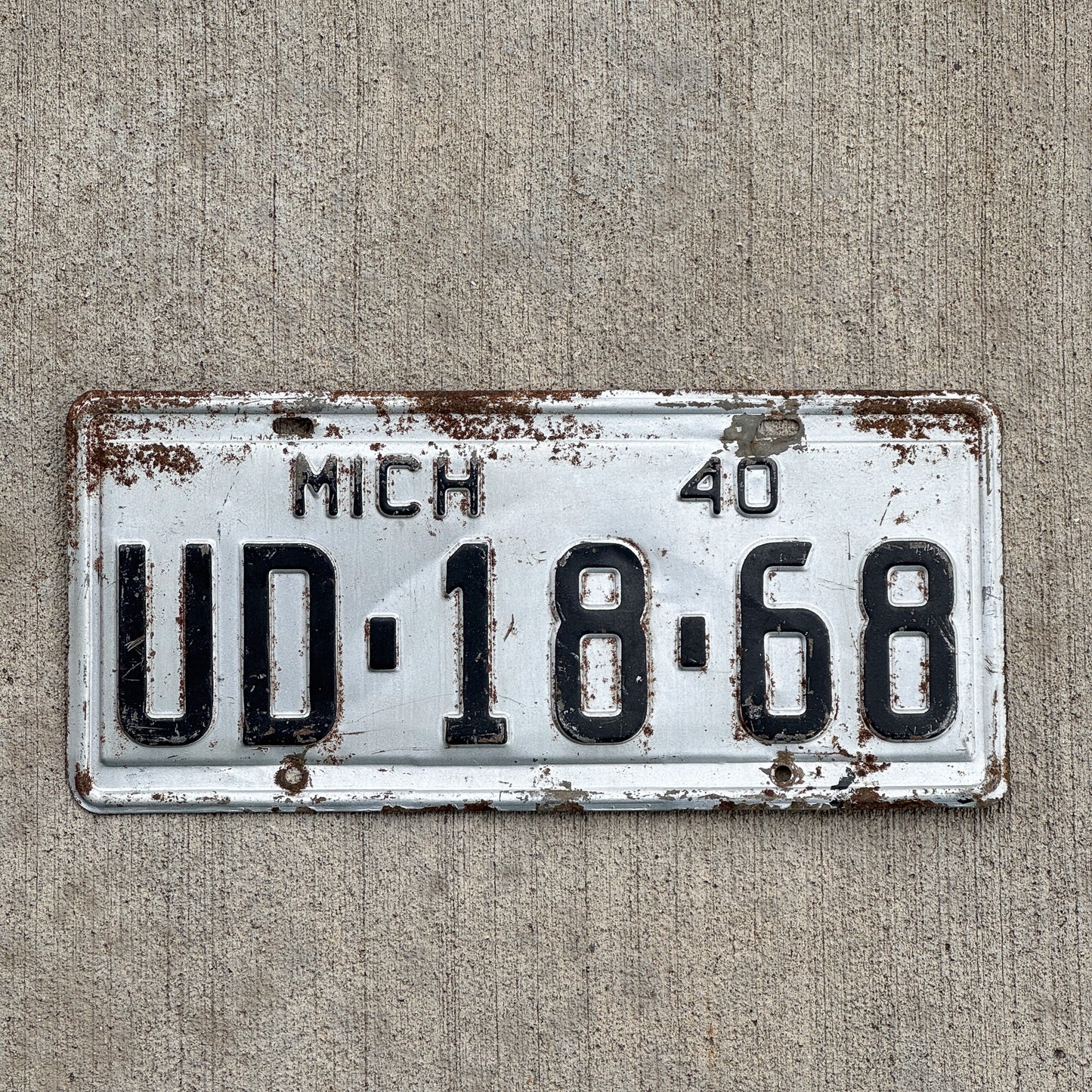 Photo of a 1940 Michigan License Plate Auto Tag Garage Decor Vintage Kalkaska County UD 1868 with original patina