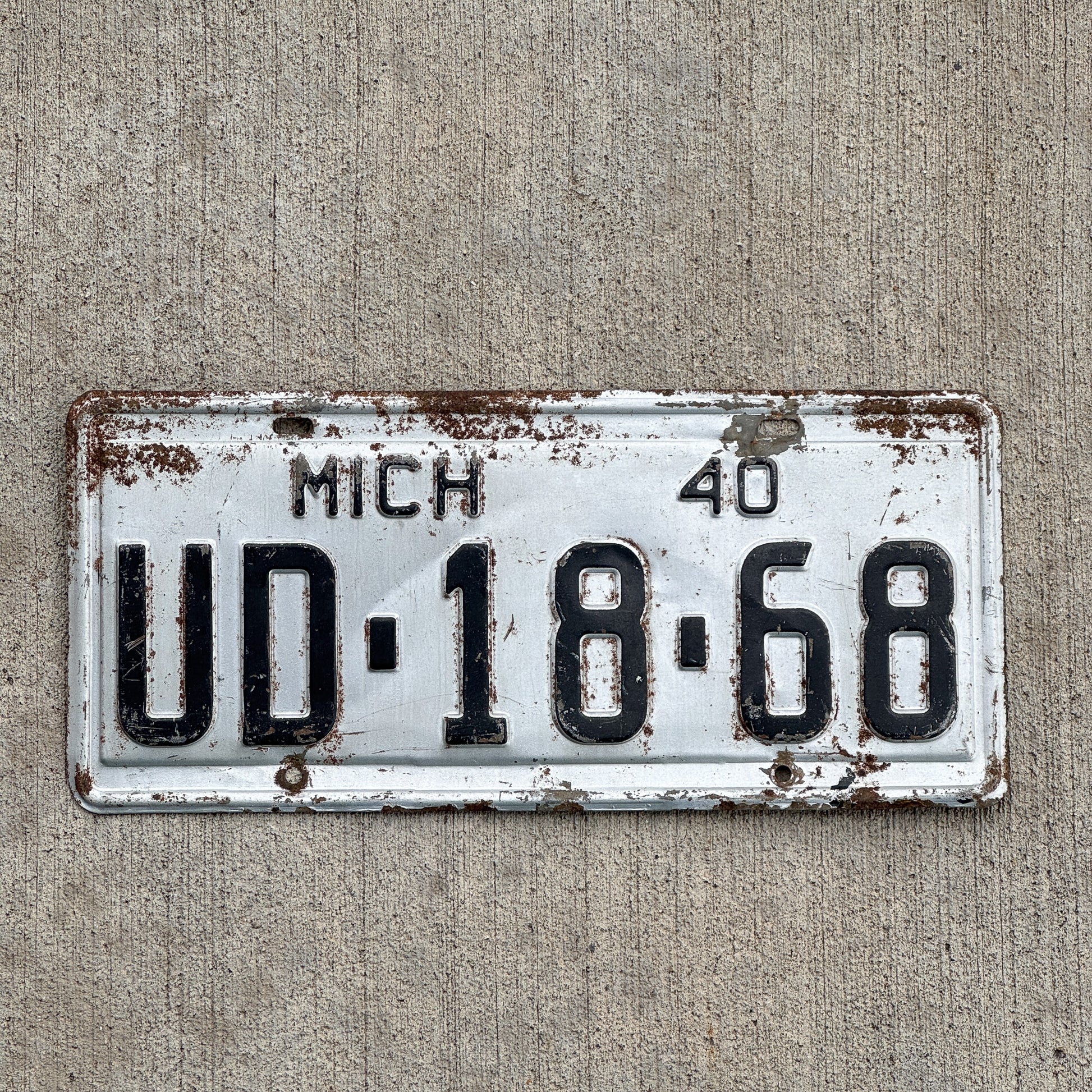 Photo of a 1940 Michigan License Plate Auto Tag Garage Decor Vintage Kalkaska County UD 1868 with original patina