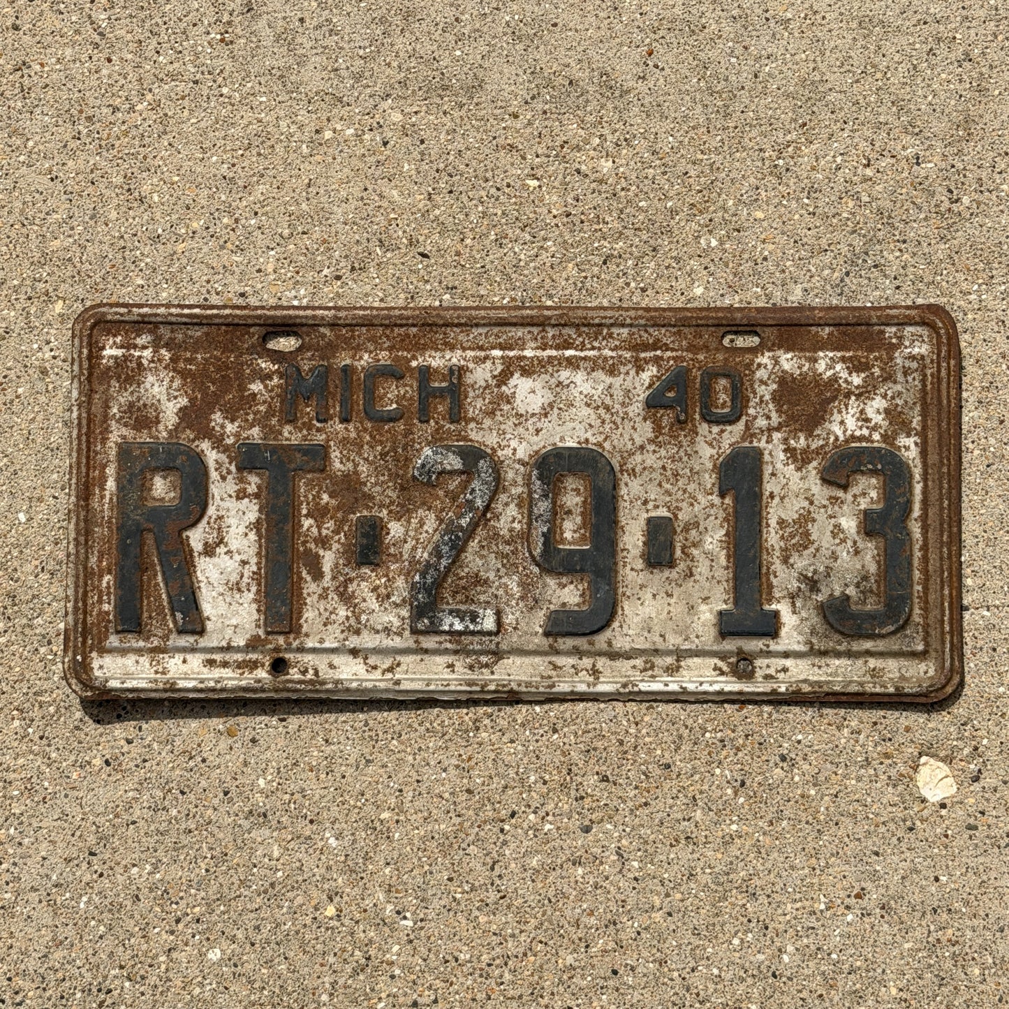 Photo of a 1940 Michigan License Plate Auto Tag Garage Decor Vintage RT 29 13 with original patina