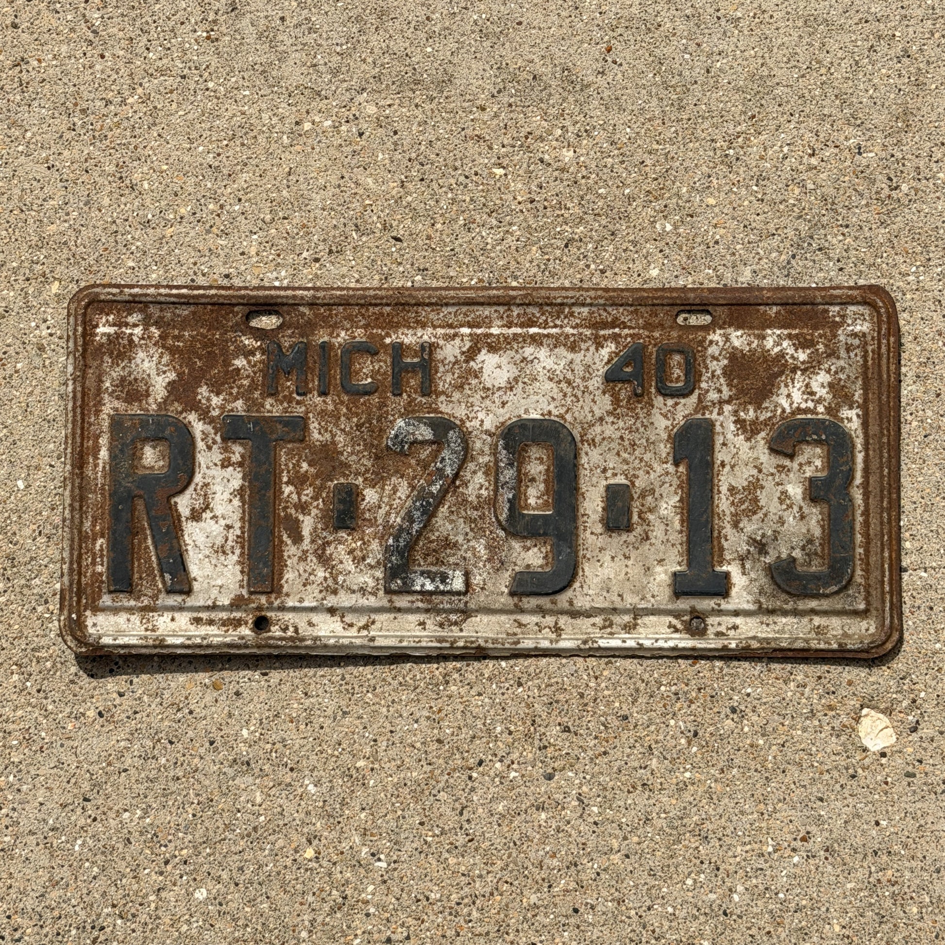 Photo of a 1940 Michigan License Plate Auto Tag Garage Decor Vintage RT 29 13 with original patina