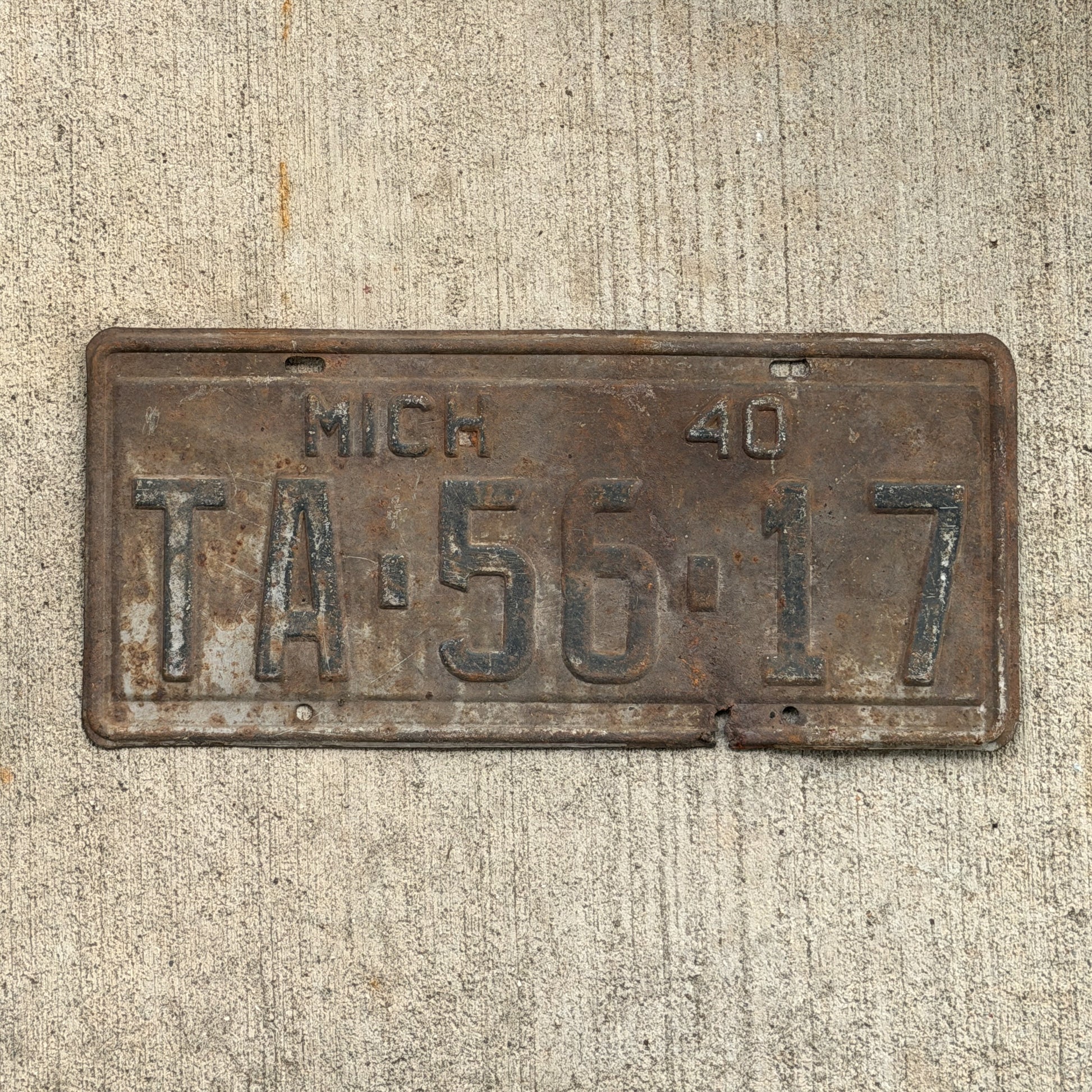 Photo of a 1940 Michigan License Plate Auto Tag Garage Decor Vintage TA 56 17 with original patina