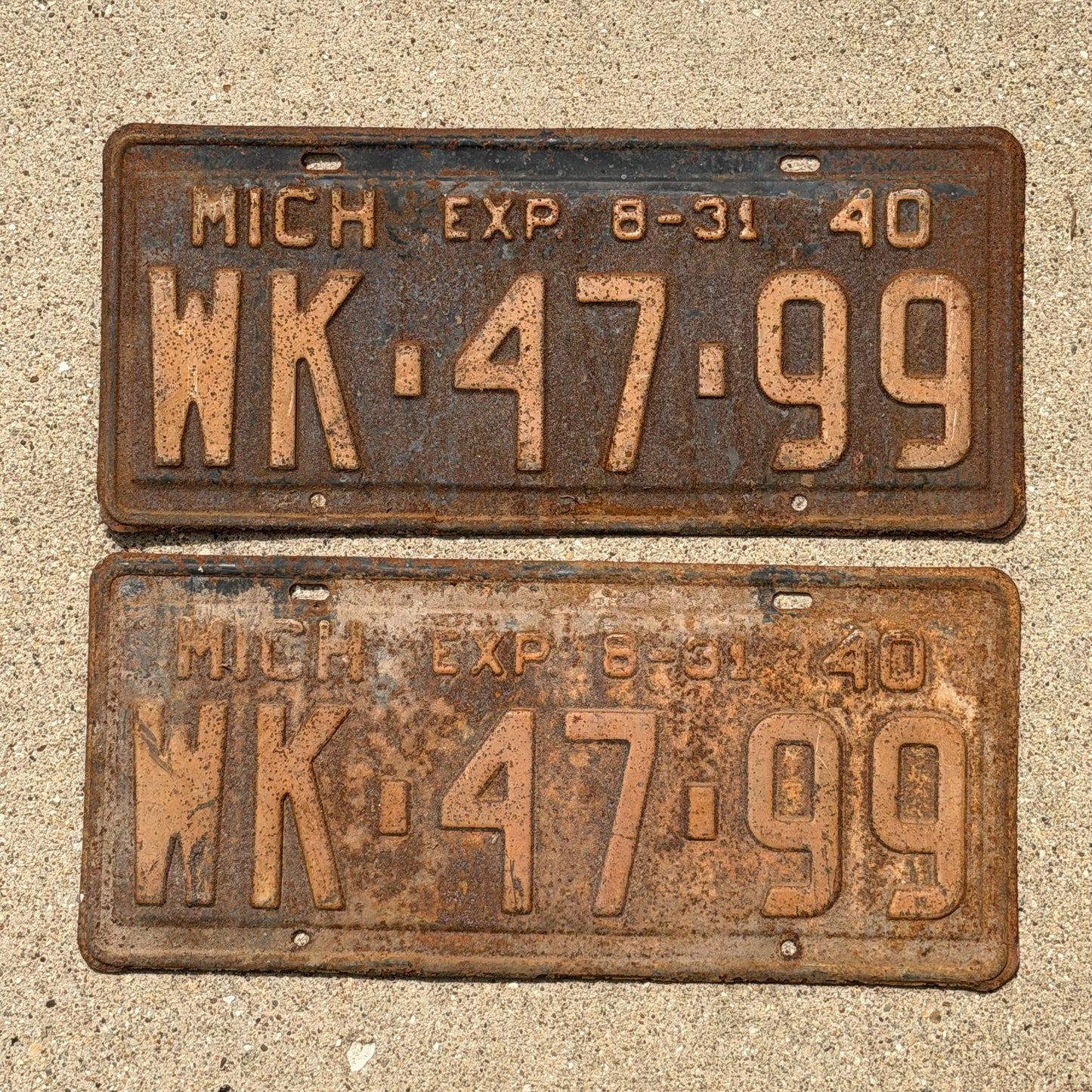 Photo of a 1940 Michigan License Plate Pair Auto Tag Garage Decor Vintage Half Year WK 47 99 with original patina