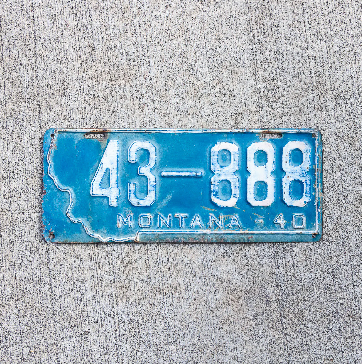 Photo of a 1940 Montana License Plate Auto Tag Garage Decor Vintage State Shape Repeat Repeating 43 888 with original patina