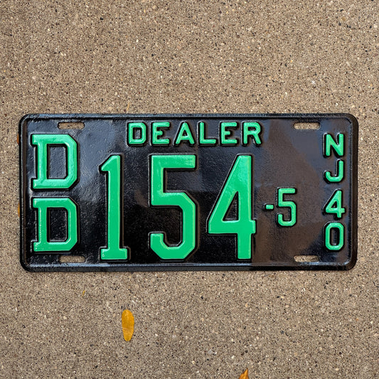 Photo of a 1940 New Jersey Dealer License Plate Auto Tag Garage Decor Vintage DD 154 5 with original patina