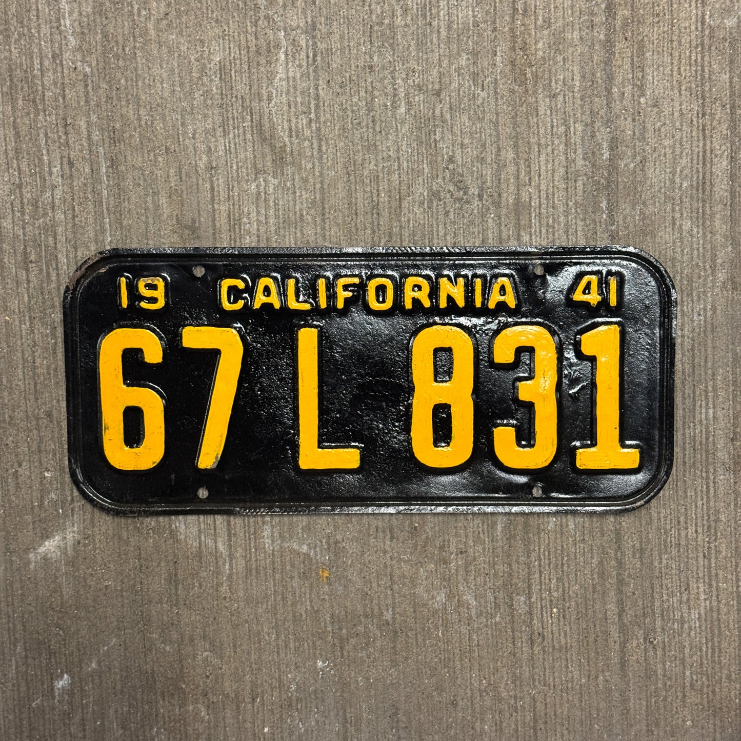 Photo of a 1941 California License Plate Auto Tag Garage Decor Vintage 67 L 831 with original patina