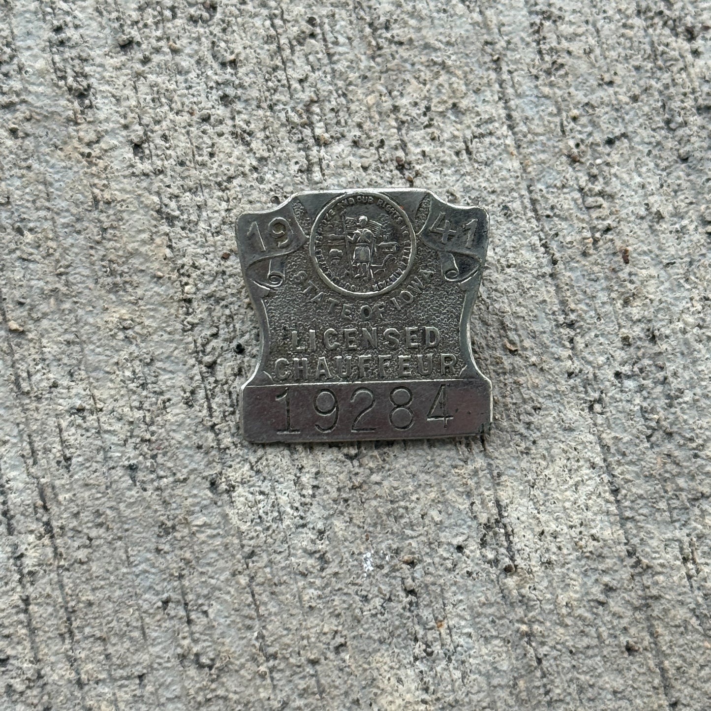 Photo of a 1941 Iowa Chauffeur Badge Auto Tag Garage Decor Vintage Pin 19284 with original patina