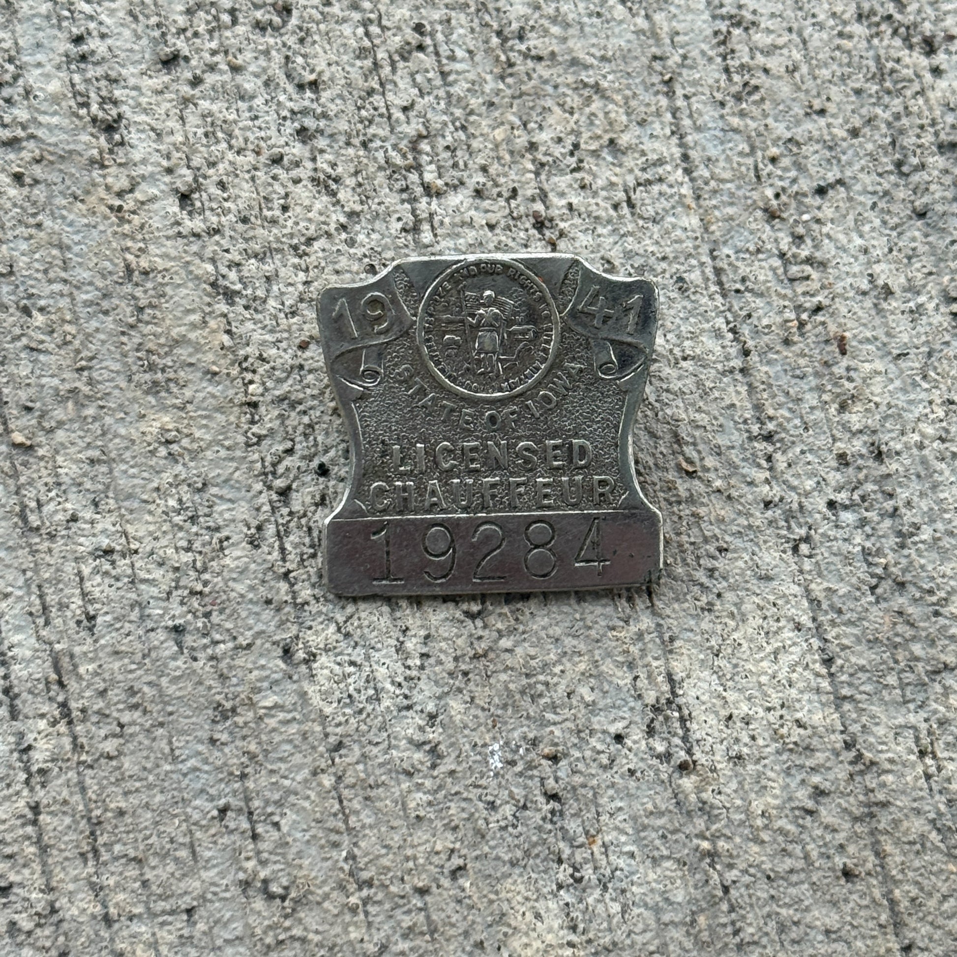 Photo of a 1941 Iowa Chauffeur Badge Auto Tag Garage Decor Vintage Pin 19284 with original patina