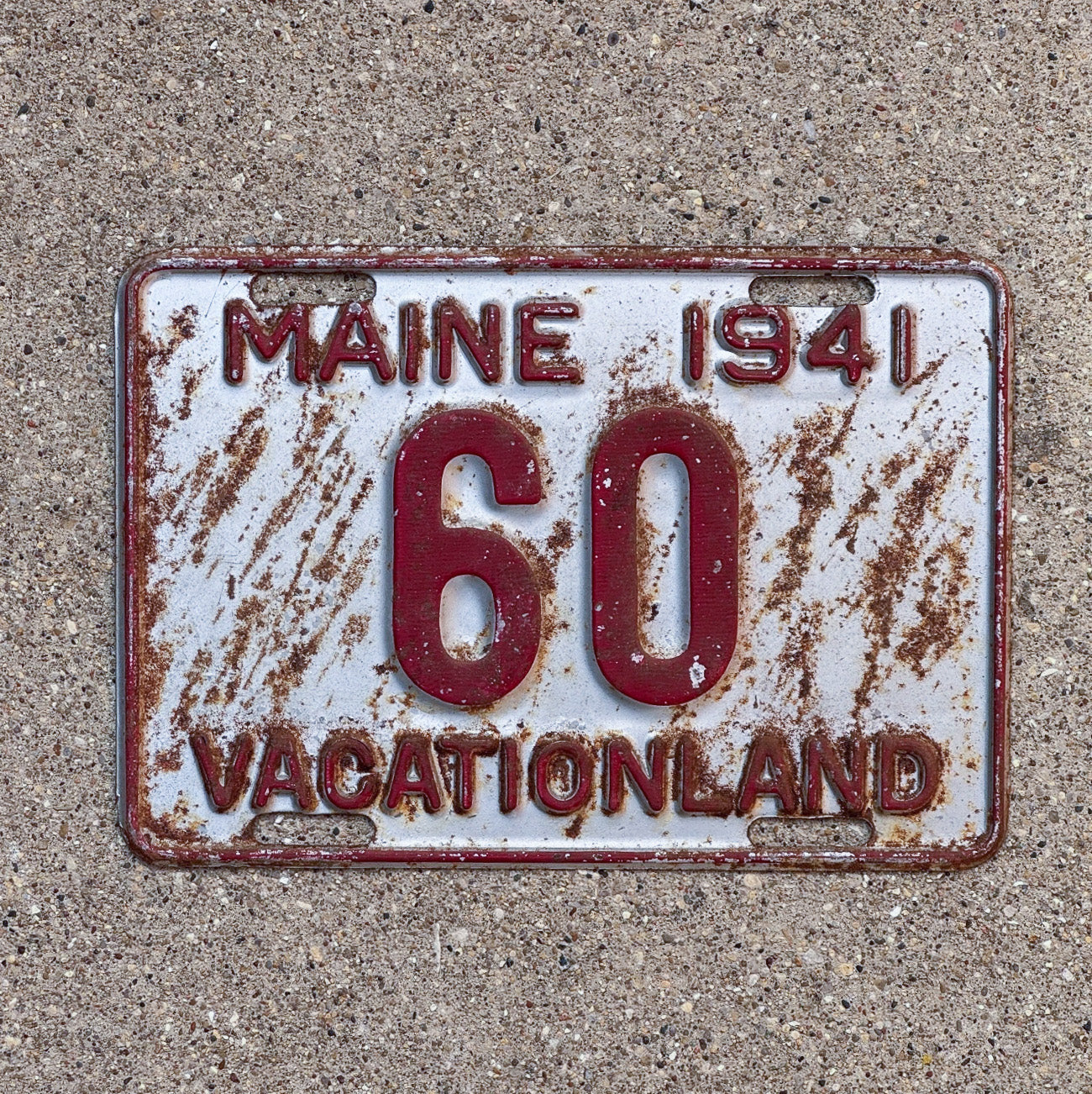 Photo of a 1941 Maine License Plate Auto Tag Garage Decor Vintage Low Number Two Digit 60 with original patina