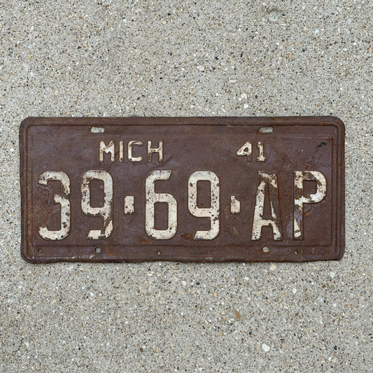 Photo of a 1941 Michigan Commercial License Plate Auto Tag Garage Decor Vintage 39 69 AP with original patina