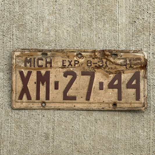 Photo of a 1941 Michigan License Plate Auto Tag Garage Decor Vintage Half Year XM 27 44 with original patina