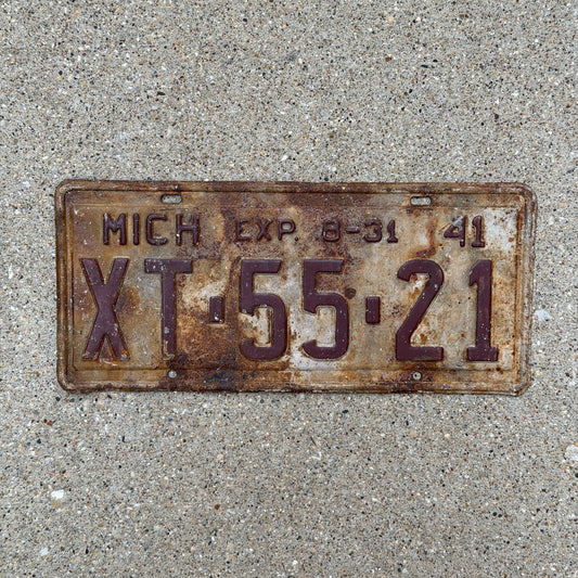 Photo of a 1941 Michigan License Plate Auto Tag Garage Decor Vintage Half Year XT 55 21 with original patina