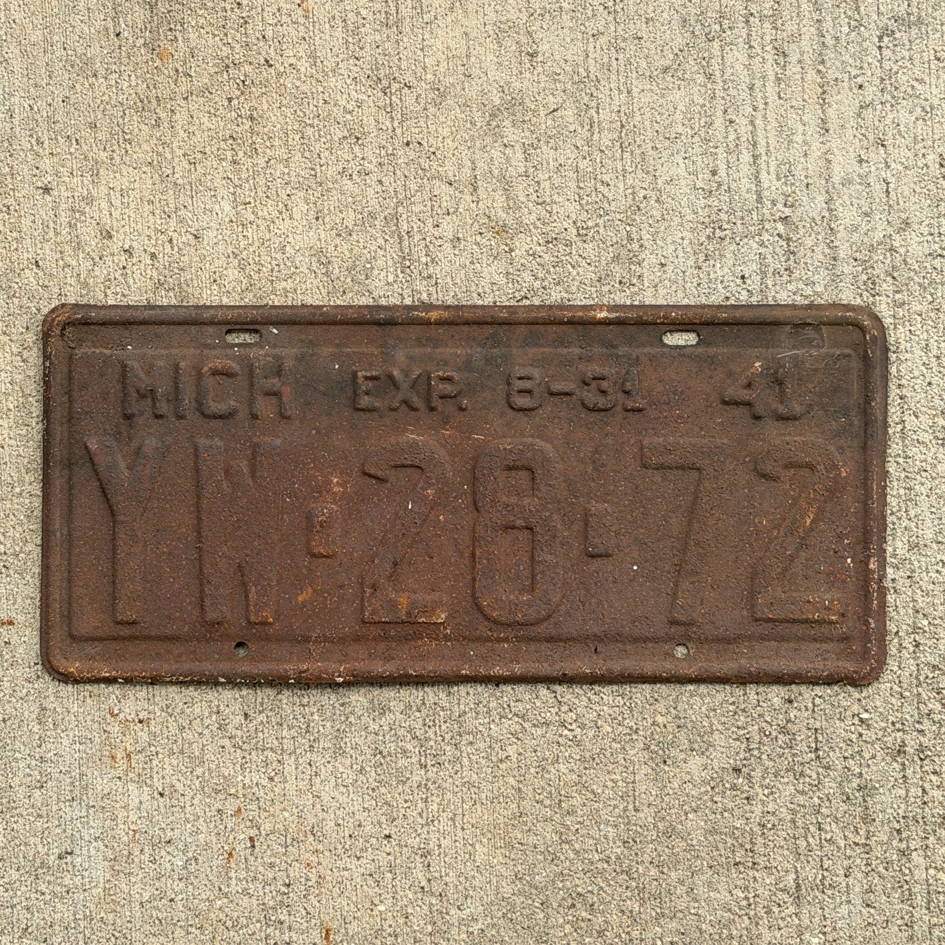Photo of a 1941 Michigan License Plate Auto Tag Garage Decor Vintage Half Year YW 28 72 with original patina