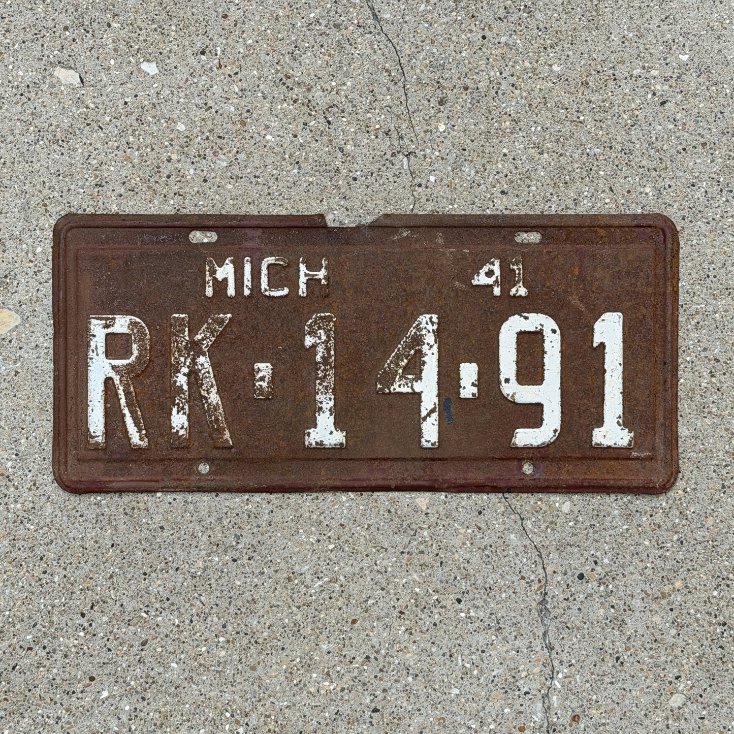 Photo of a 1941 Michigan License Plate Auto Tag Garage Decor Vintage RK 14 91 with original patina