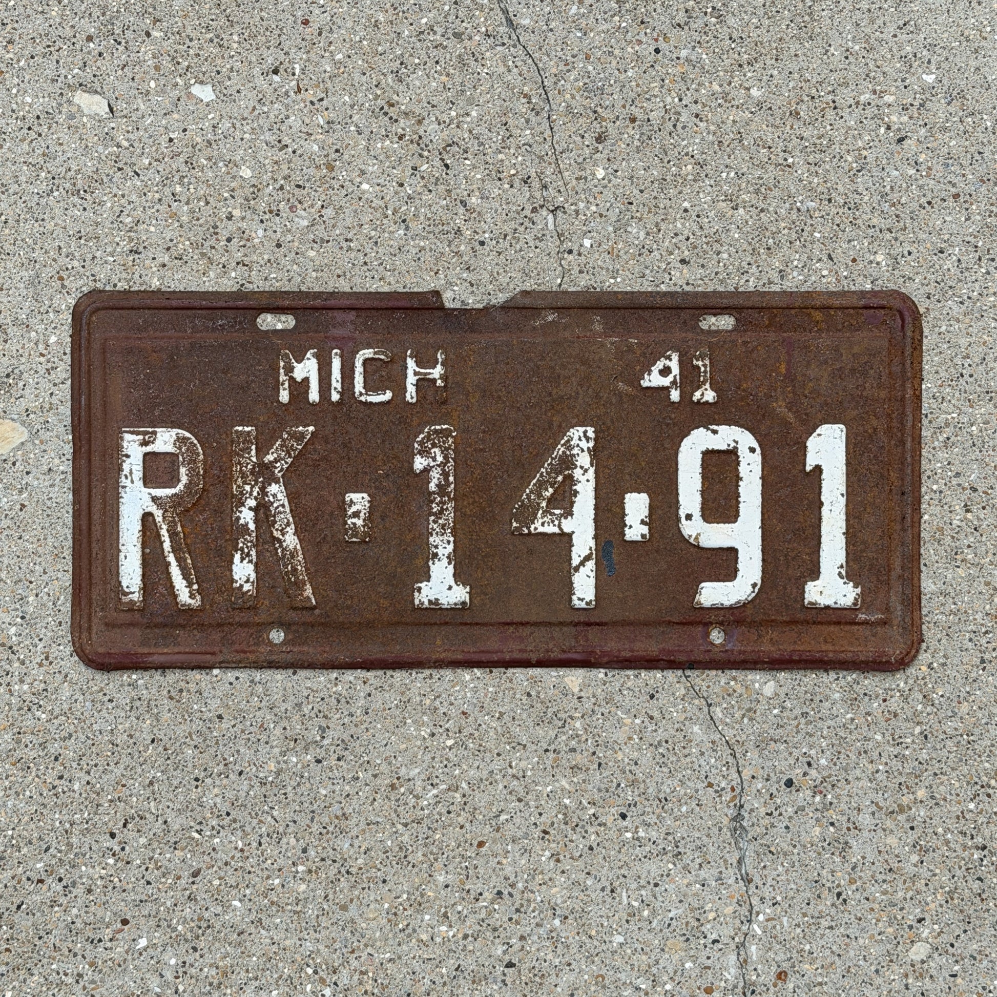 Photo of a 1941 Michigan License Plate Auto Tag Garage Decor Vintage RK 14 91 with original patina