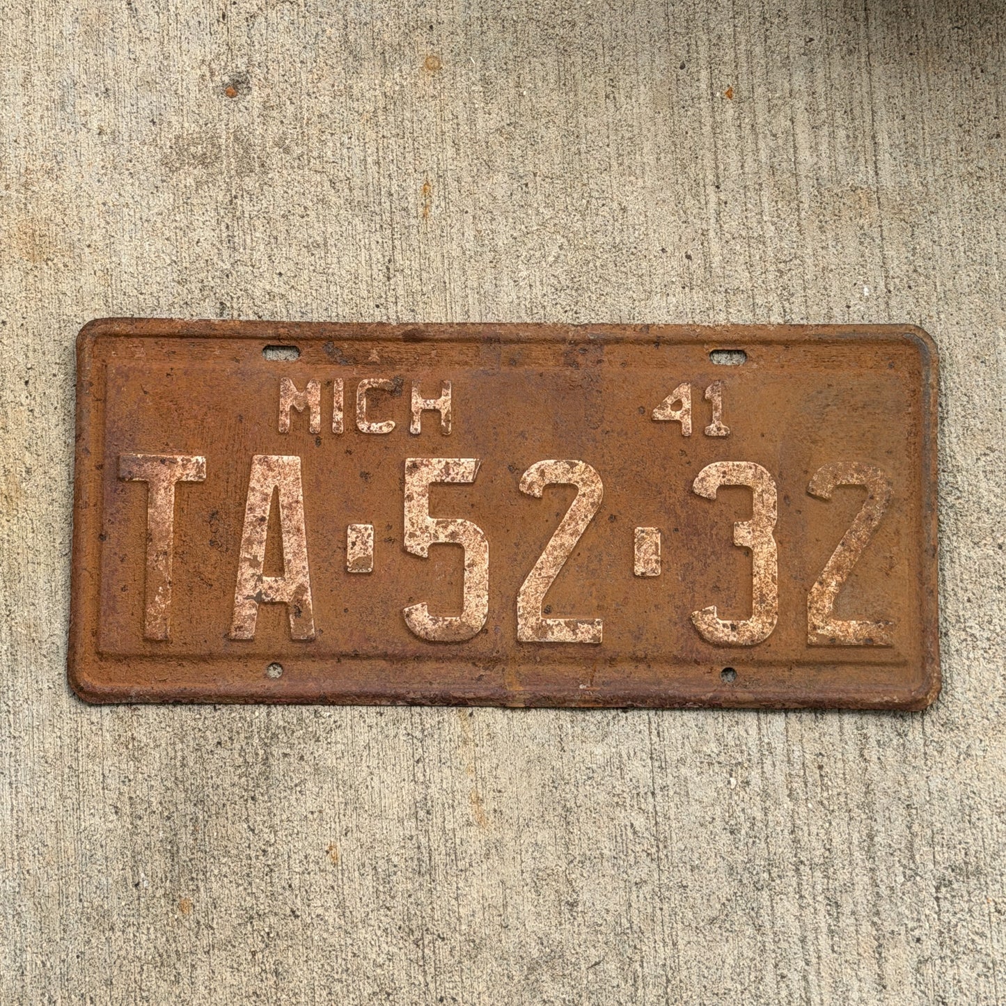 Photo of a 1941 Michigan License Plate Auto Tag Garage Decor Vintage TA 52 32 with original patina