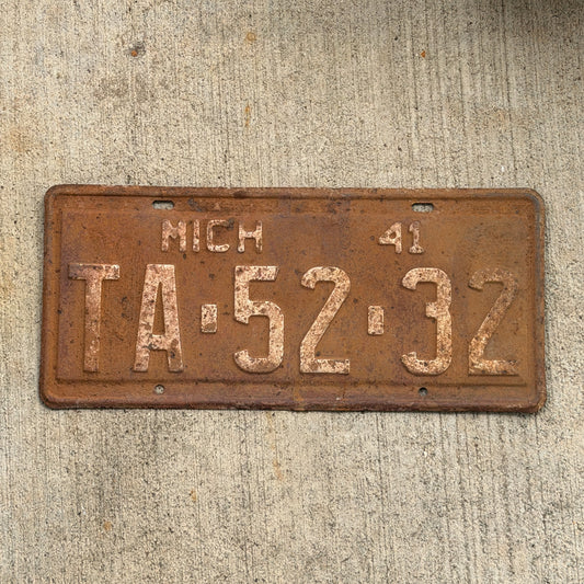Photo of a 1941 Michigan License Plate Auto Tag Garage Decor Vintage TA 52 32 with original patina