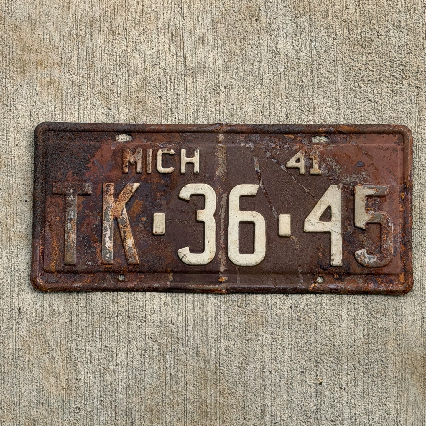 Photo of a 1941 Michigan License Plate Auto Tag Garage Decor Vintage TK 36 45 with original patina