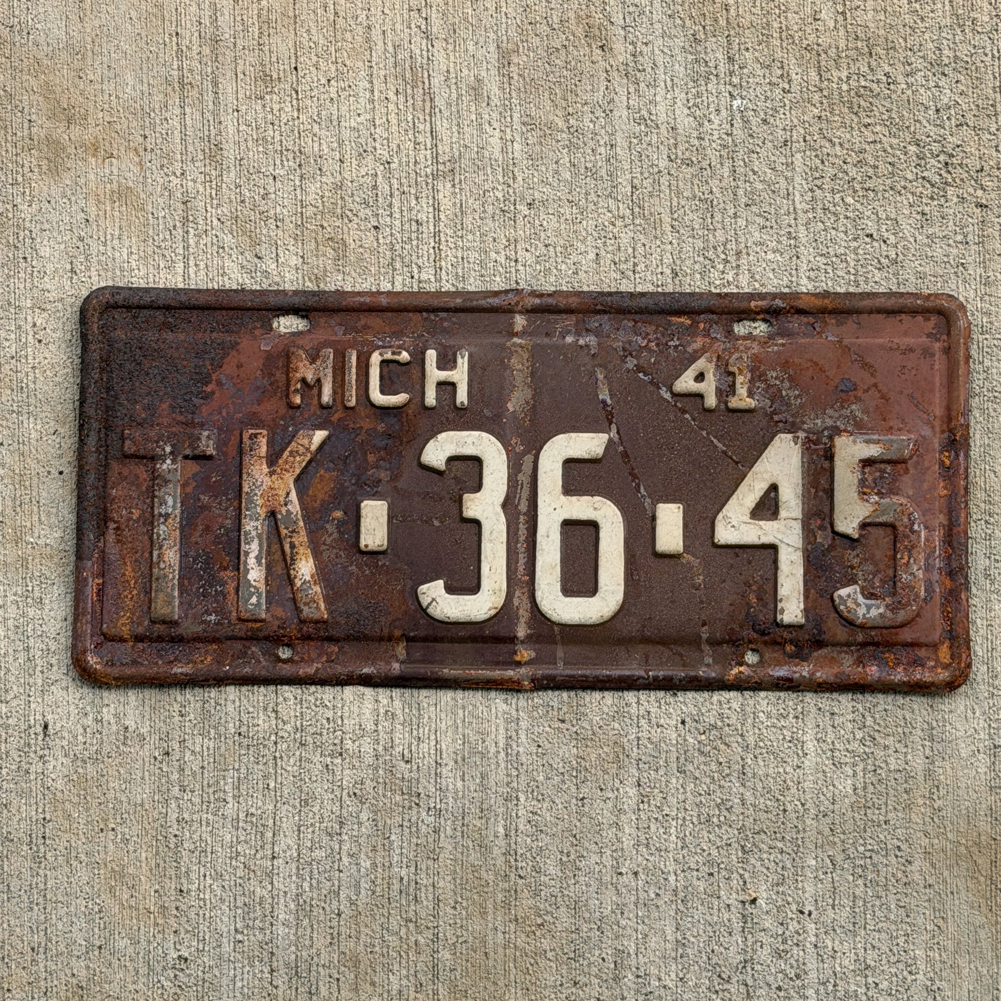 Photo of a 1941 Michigan License Plate Auto Tag Garage Decor Vintage TK 36 45 with original patina